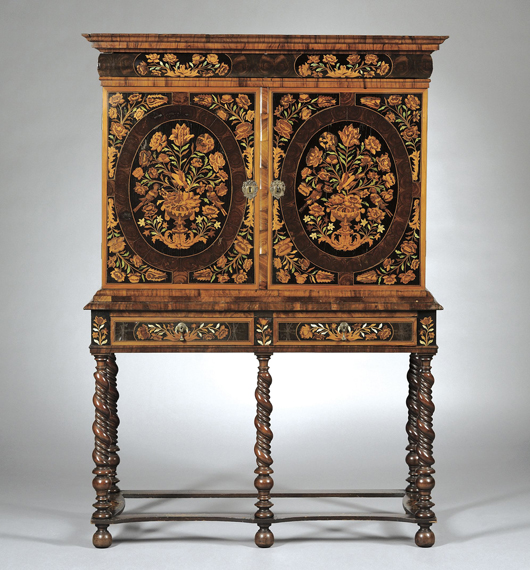 Dutch marquetry cabinet on stand, late 19th century with various oyster-veneered drawers and central marquetry cupboard door. Estimate $2,000-$3,000. Image courtesy of Skinner Inc.